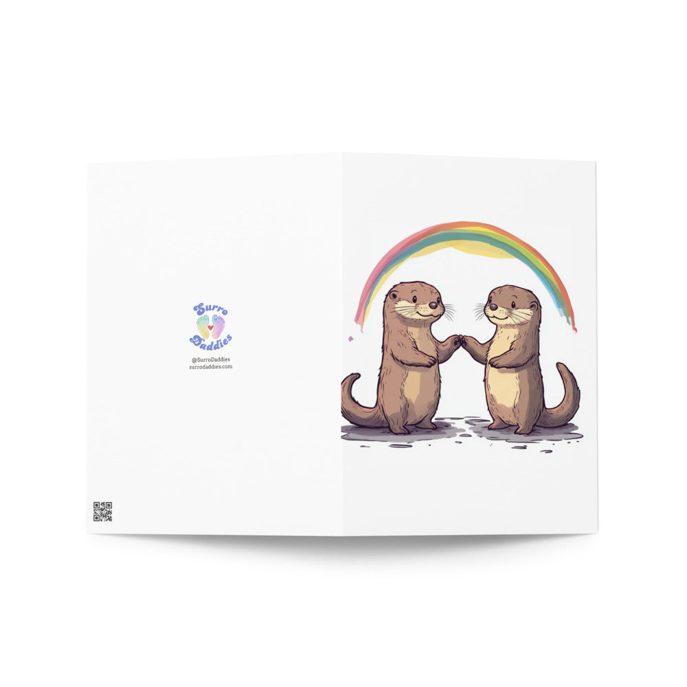 Adorable otters holding hands
